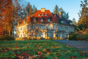 large victorian style home with a red roof