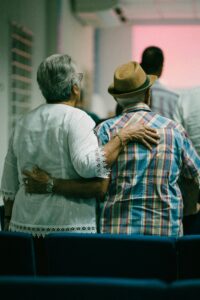 retired couple standing together in an airport